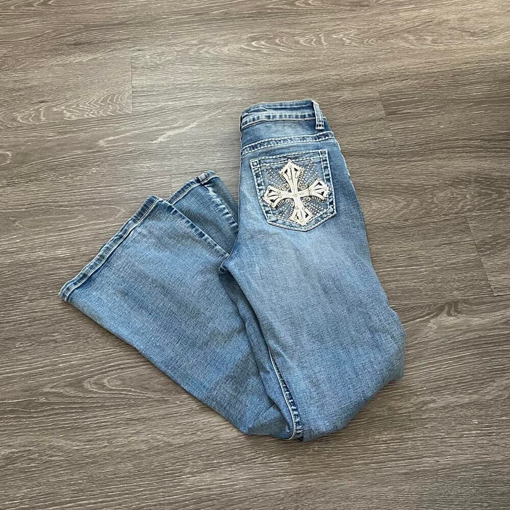 Grunge rhinestone cross detailed jeans